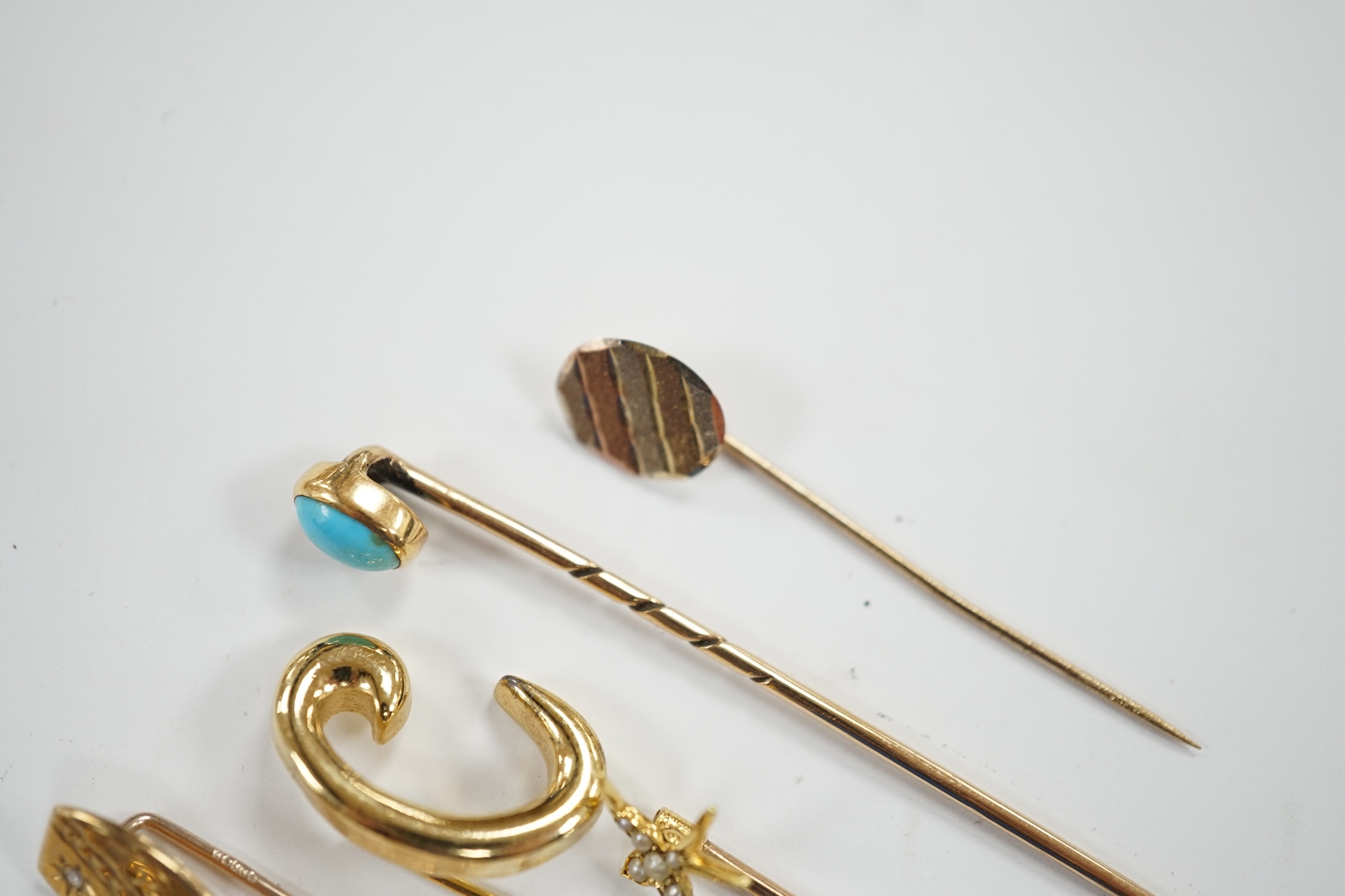 Fifteen assorted mainly early 20th century yellow metal and gem set stick pins, including diamond, seed pearl and banded agate, gross weight 23.1 grams.